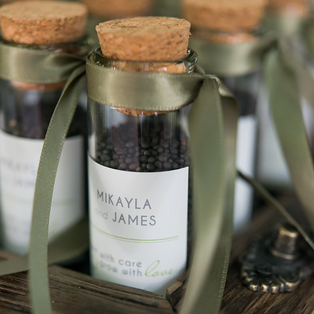 Petite bouteille en verre avec faveur de mariage de bouchon de liège